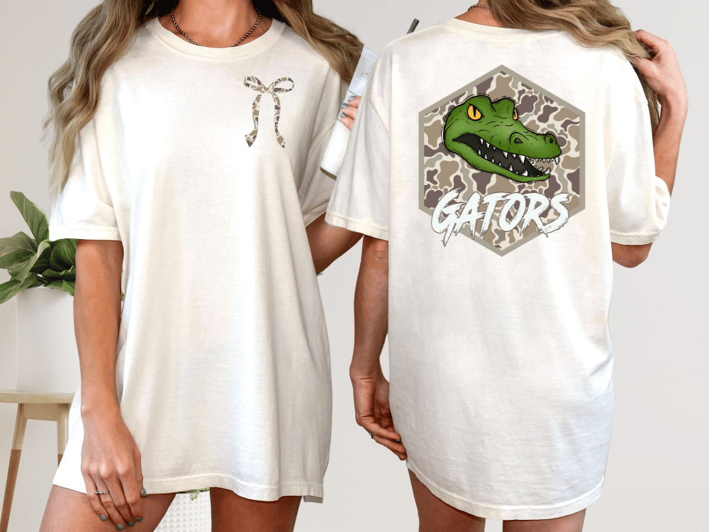 two different views of a white t-shirt with a graphic design on the back. The design features a green alligator head with the word "GATORS" written below it.