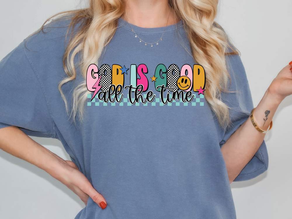 a woman wearing a blue shirt with the words gossip all the time on it
