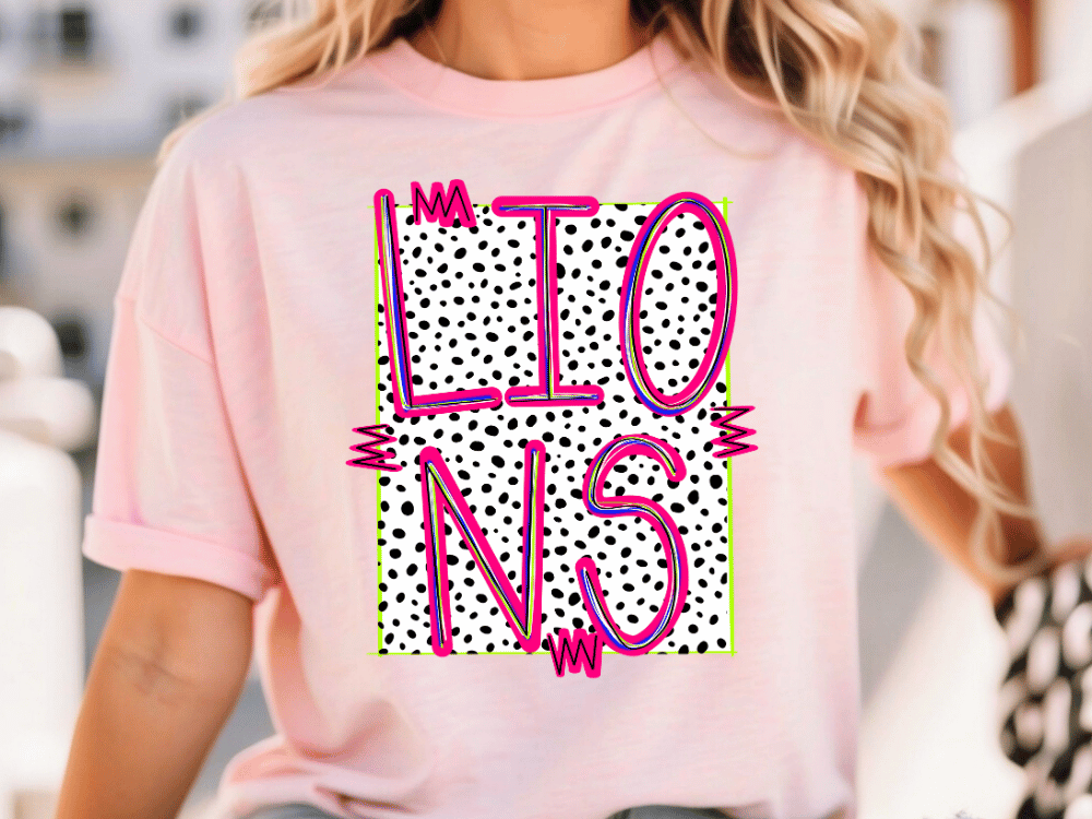 A woman wearing a pink t-shirt with a graphic design featuring the word "LIONS" in pink and black polka dots.