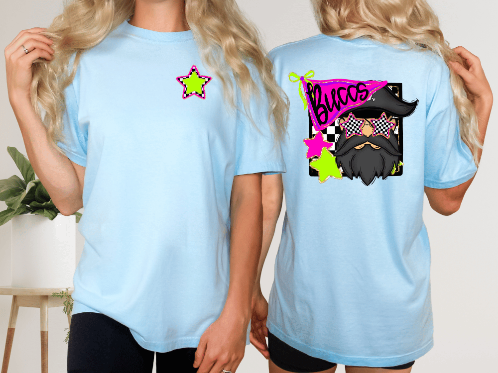 two women wearing light blue t-shirts with colorful designs on the back.