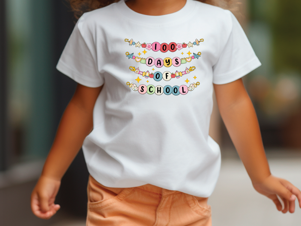 a little girl walking down a sidewalk wearing a white shirt that says 100 days of