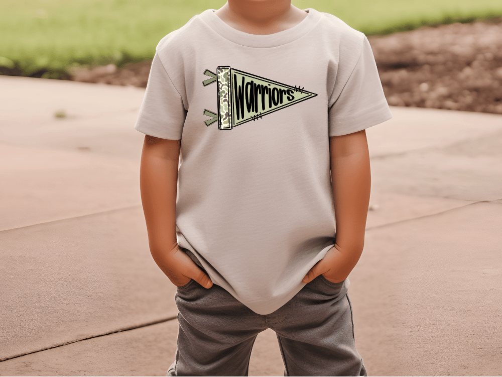 A child wearing a white t-shirt with a graphic design of a flag and the word "Warriors" printed on it.