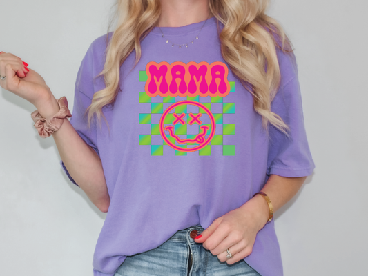 a woman wearing a purple shirt with the word mama on it