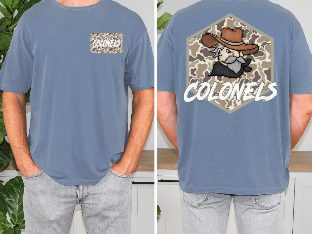 a man wearing a blue t-shirt with a cartoon cowboy character and the text "COLONELS" printed on the back.
