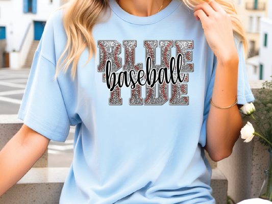a woman wearing a blue shirt with the word ride baseball printed on it