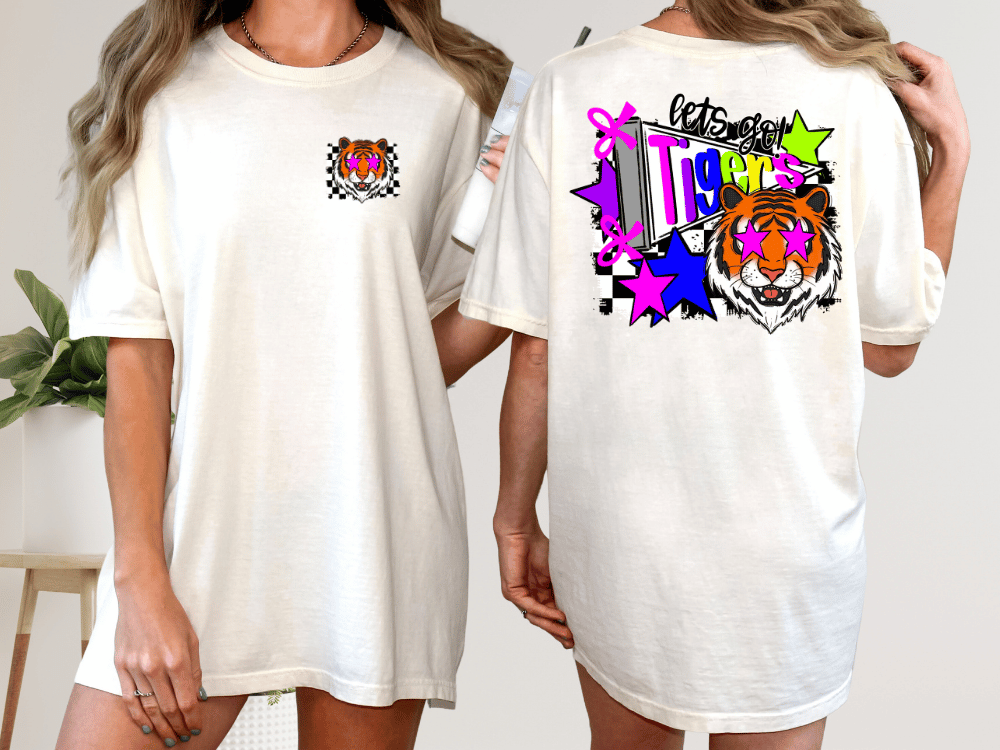 A woman wearing a white t-shirt with a tiger graphic and colorful designs on the back.