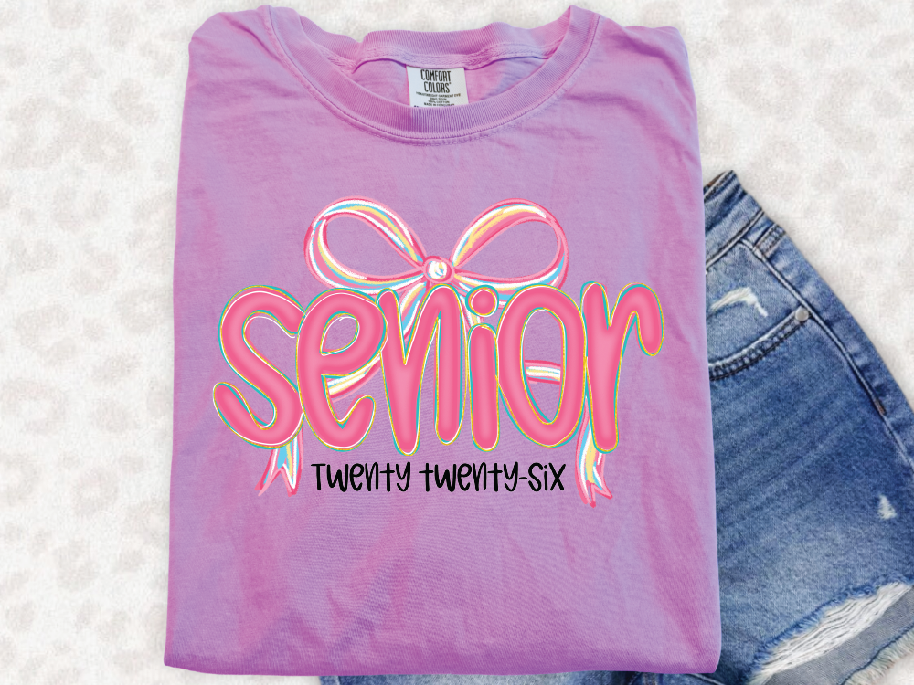 a t - shirt that says senior and a pair of shorts