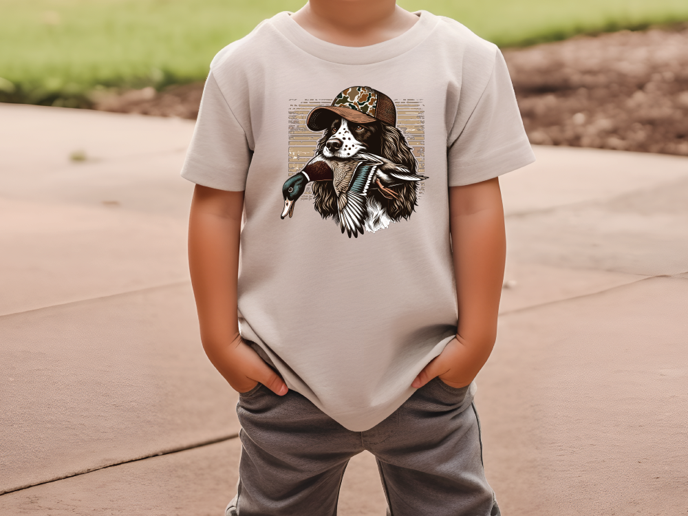 a young boy wearing a t - shirt with a picture of a native american indian