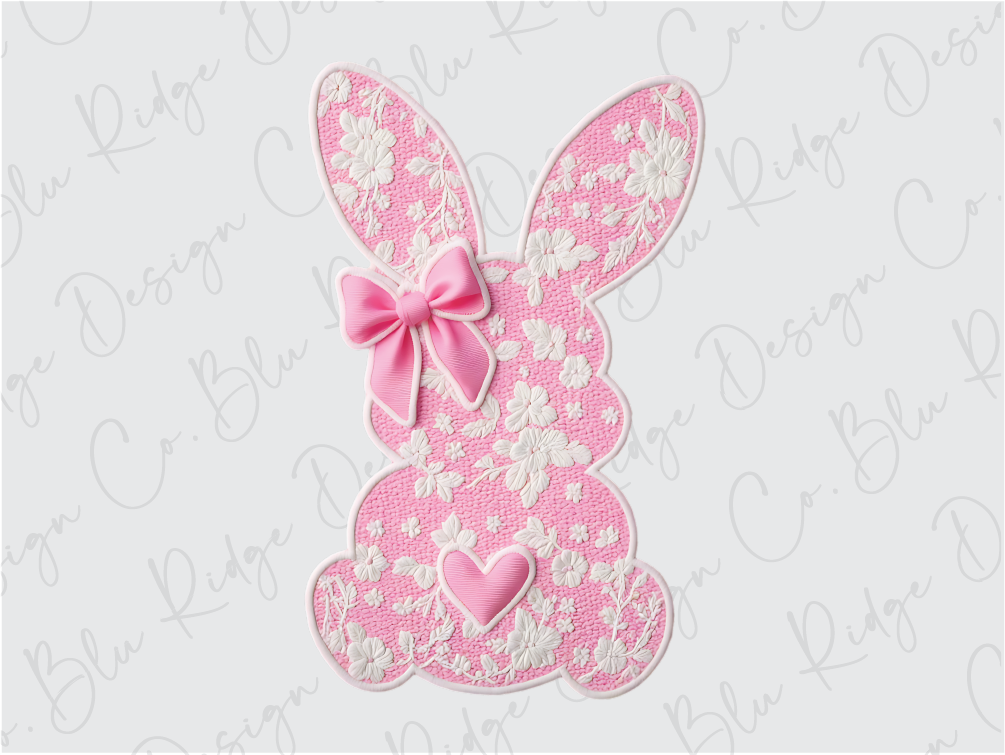 a pink and white bunny with a pink bow