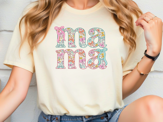 a woman wearing a t - shirt with the word mom on it