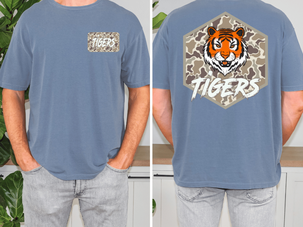 a man wearing a blue t-shirt with a tiger graphic and the word "TIGERS" printed on it.