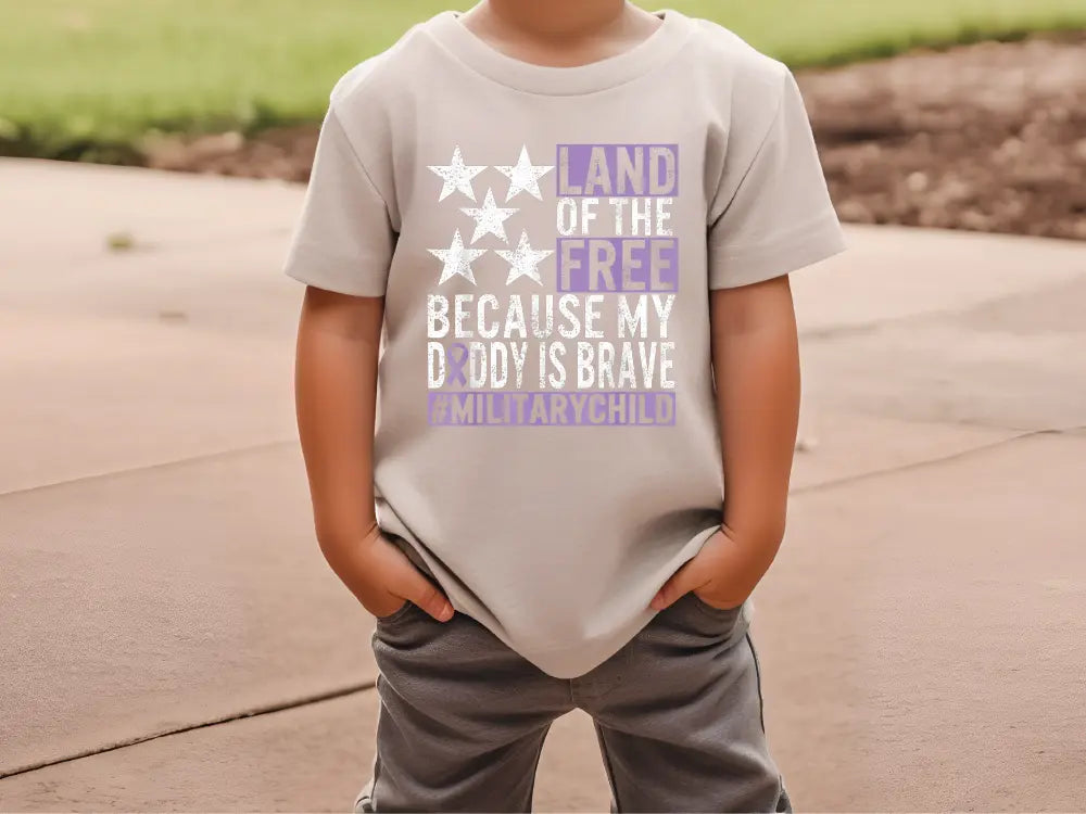 a young boy wearing a t - shirt that says land of the free because my