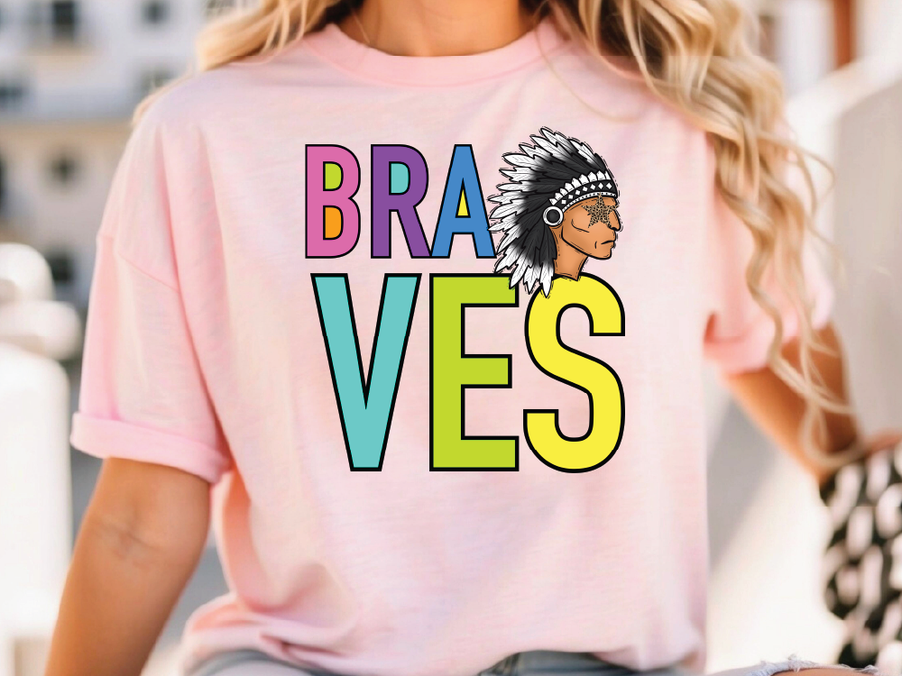 A woman wearing a pink t-shirt with the text "Braves" printed on it.