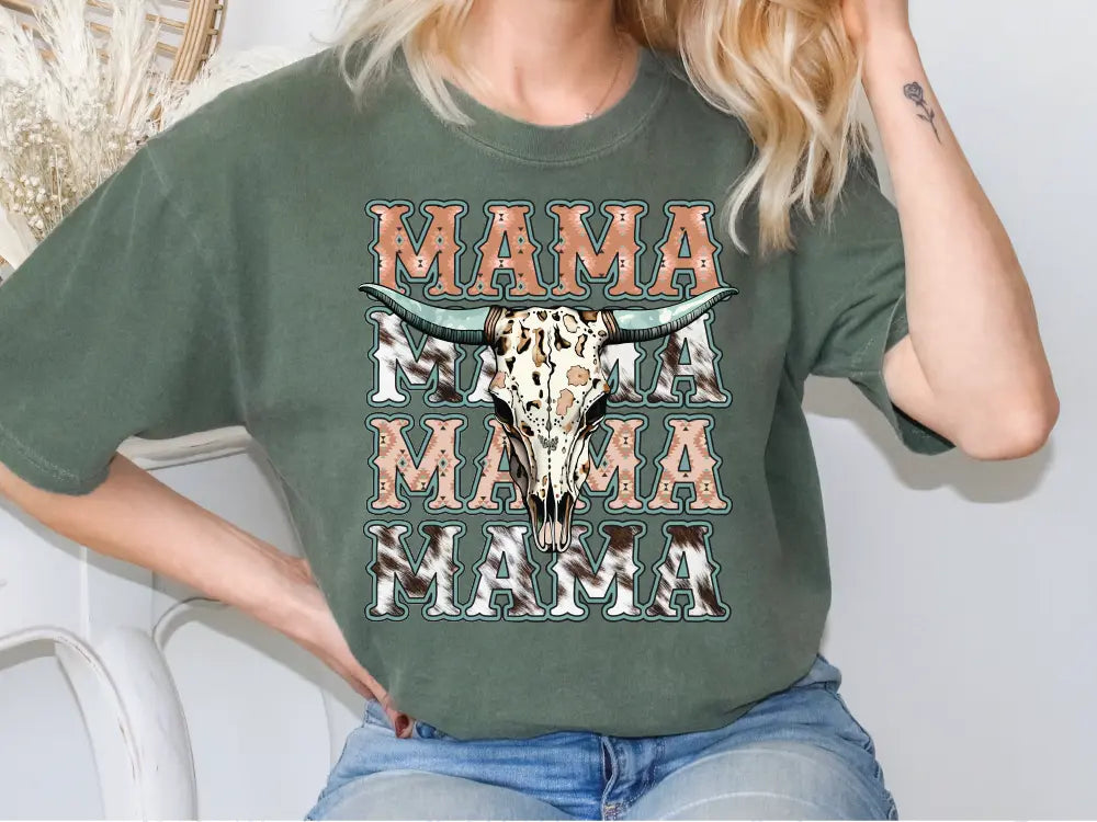 a woman wearing a green shirt with a cow skull on it