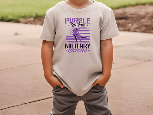 a little boy that is wearing a shirt