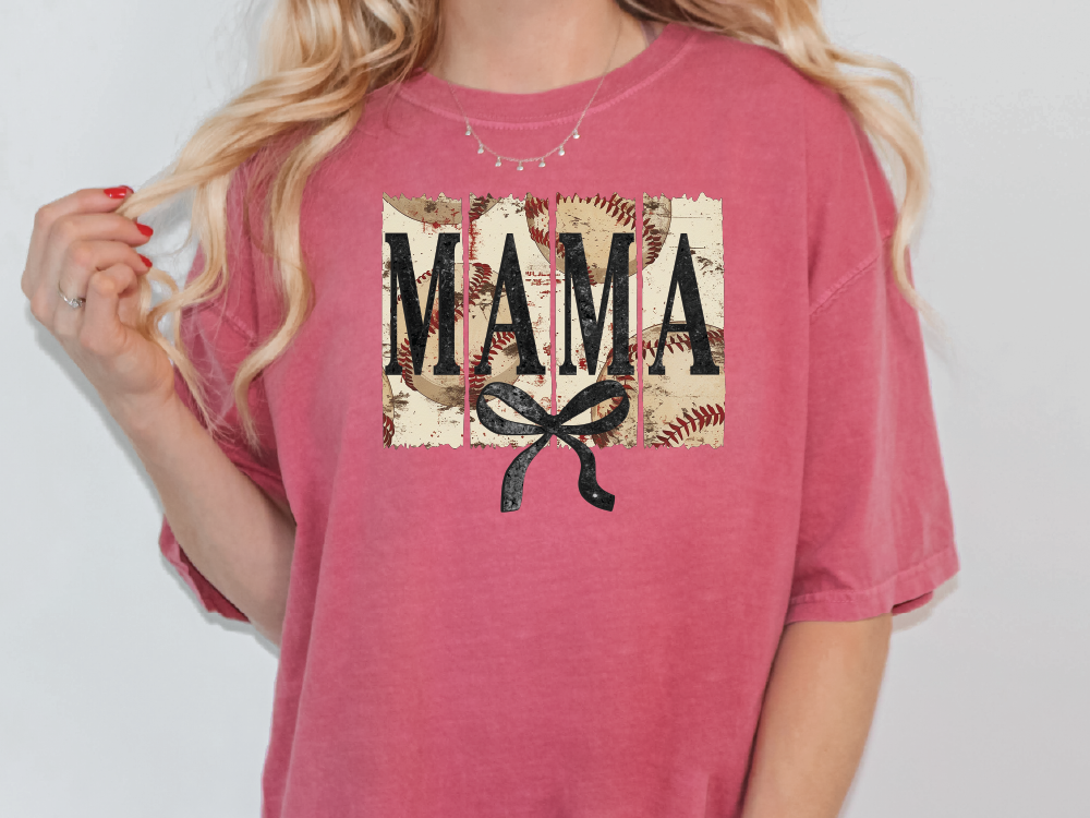 a woman wearing a pink shirt with the word mama on it