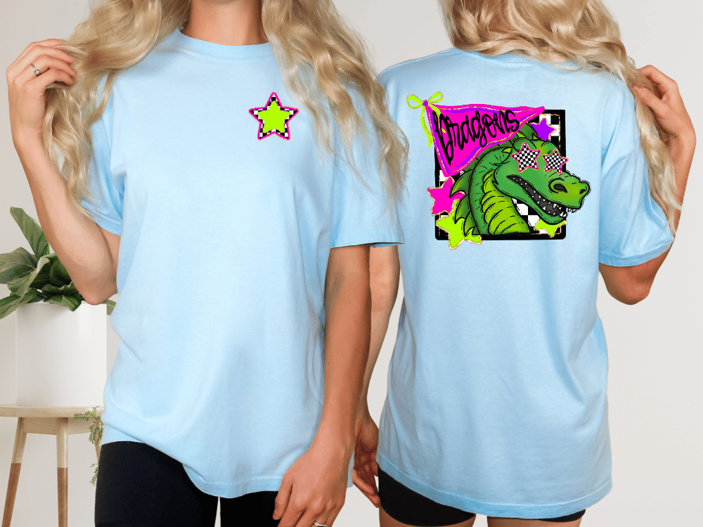 two people wearing light blue t-shirts with a graphic design featuring a green dragon wearing sunglasses.