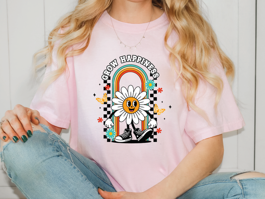 a woman wearing a pink shirt with a daisy on it