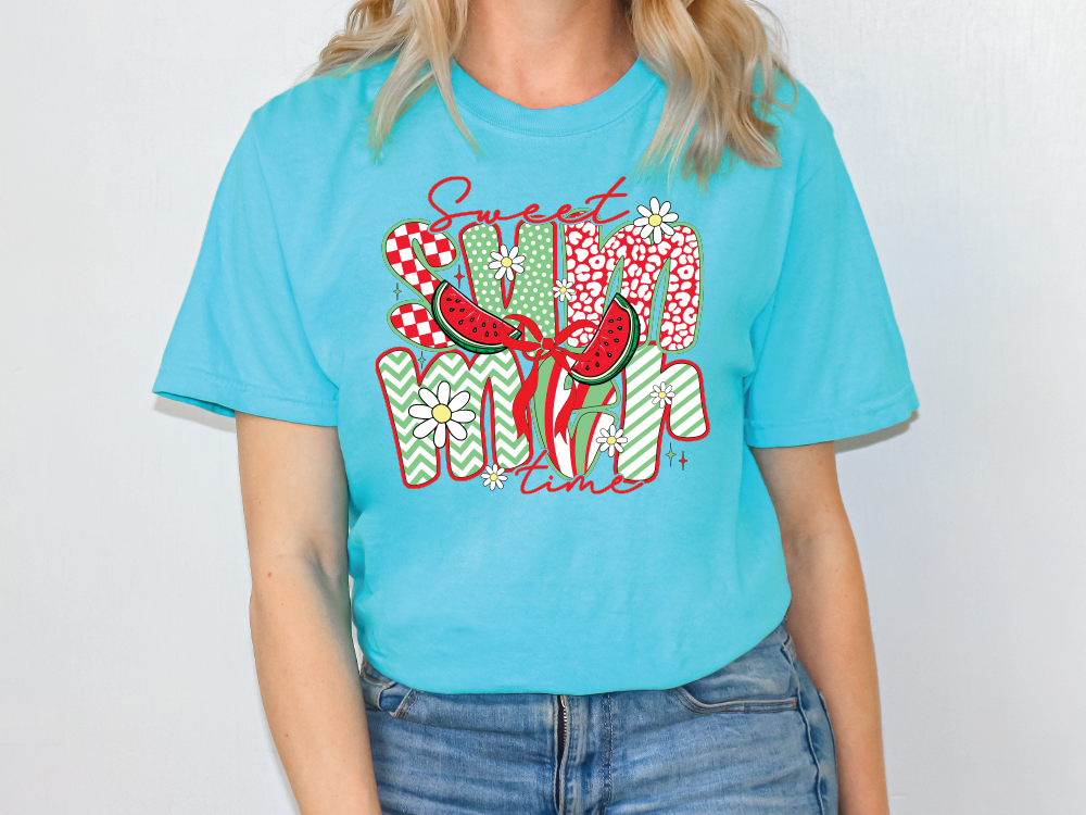 a woman wearing a blue shirt with a watermelon graphic on it