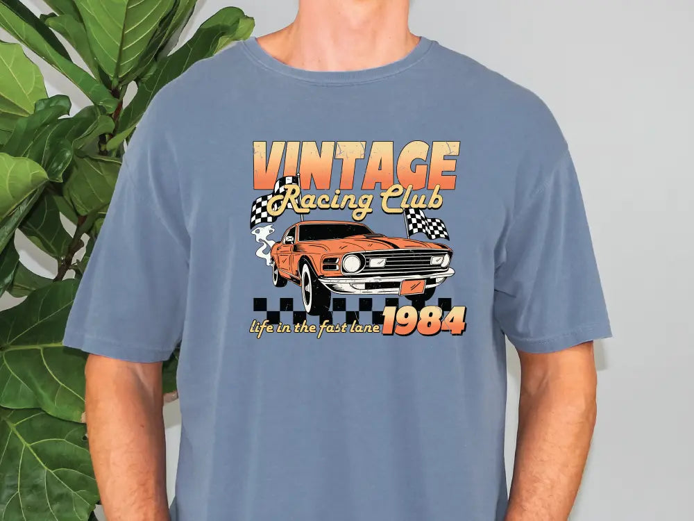 a man wearing a blue vintage racing club t - shirt