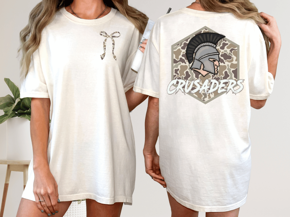 two different views of a white t-shirt with a graphic design on the back. The design features a helmet with a plume and the word "CRUSADERS" written below it.