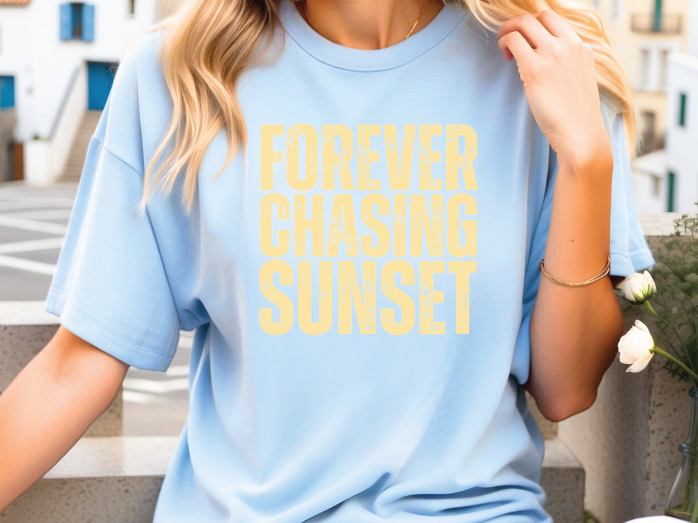 a woman wearing a blue shirt with yellow lettering on it