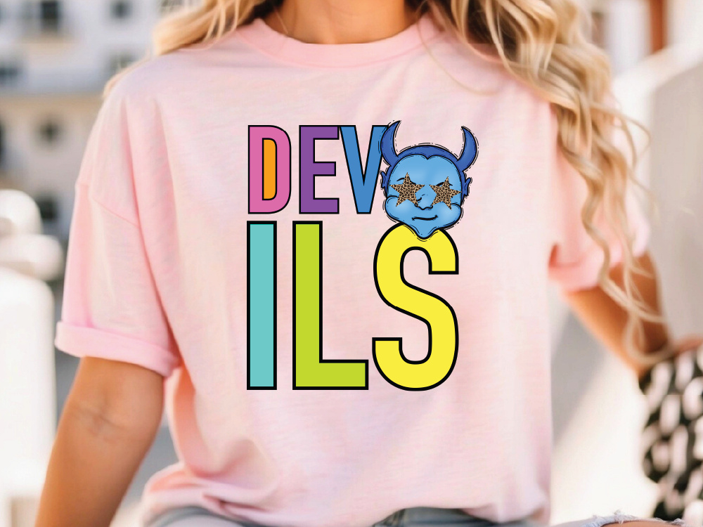 A woman wearing a pink t-shirt with the text "DEVILS" printed on it.