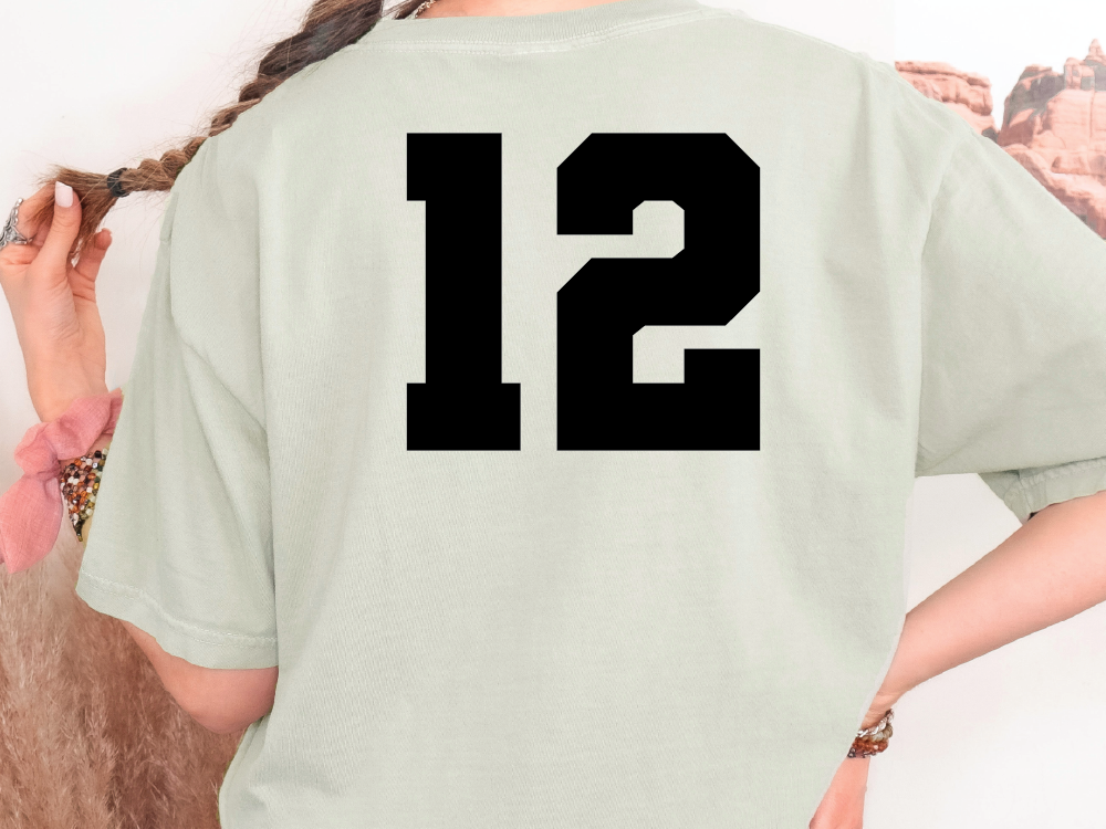 a woman wearing a t - shirt with the number 12 on it