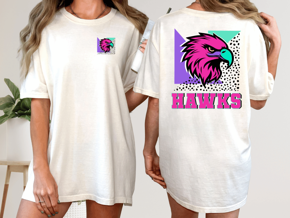 A woman wearing a white t-shirt with a graphic of a pink and purple eagle on the back.