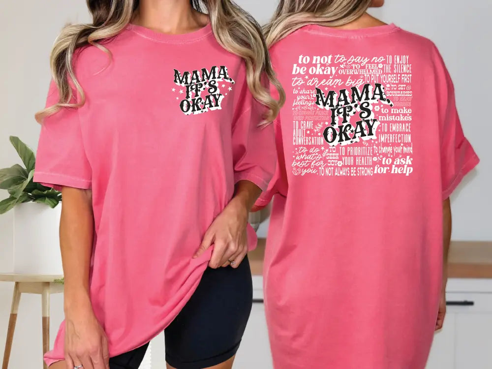 two women in matching pink shirts standing next to each other