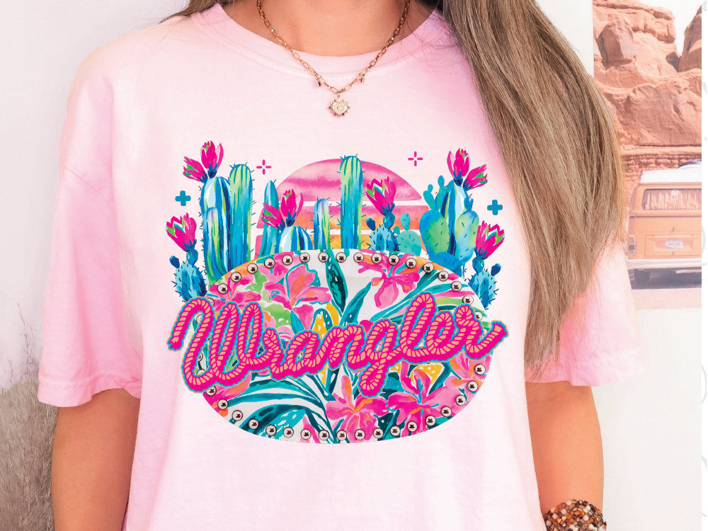 a woman with long hair wearing a pink shirt