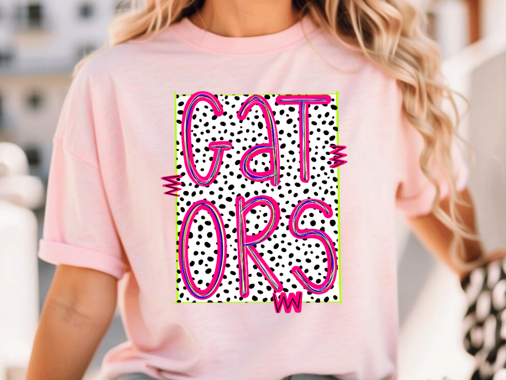 A woman wearing a pink t-shirt with the text "GATORS" printed on it.