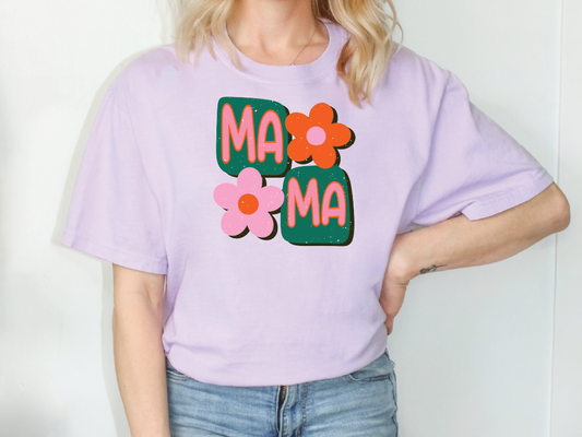 a woman wearing a purple t - shirt with flowers on it