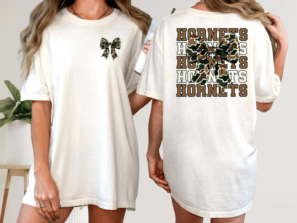 A woman wearing a white t-shirt with a graphic design on the back.