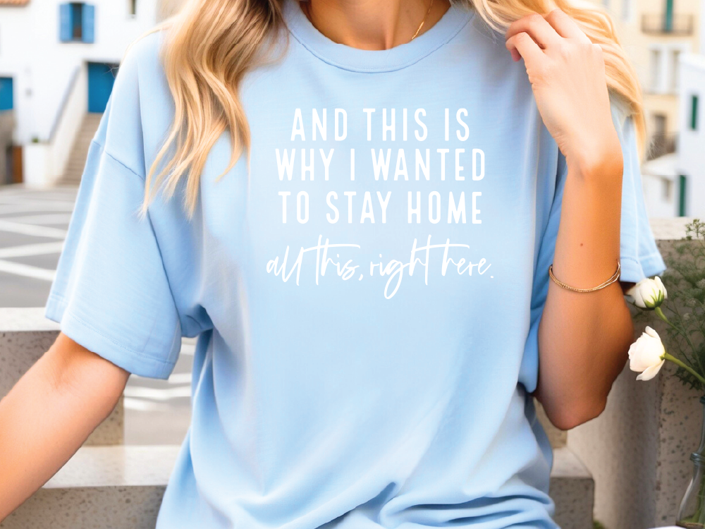 a woman wearing a blue shirt with white writing on it