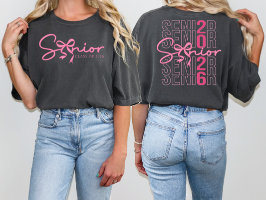 two women wearing black shirts with pink lettering