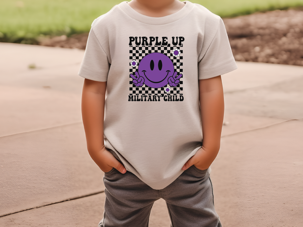 a young boy wearing a purple up military child t - shirt