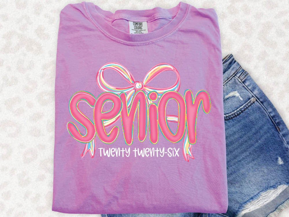 a t - shirt that says senior and a pair of shorts