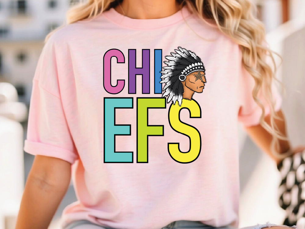 A woman wearing a pink t-shirt with the text "CHIEFS" and an illustration of a Native American headdress.