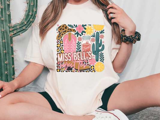 a woman wearing a t - shirt that says miss bells