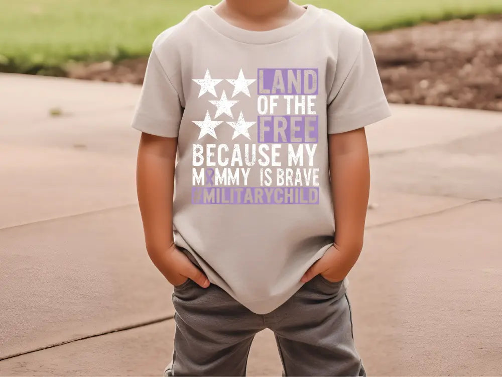 a young boy wearing a t - shirt that says land of the free because my