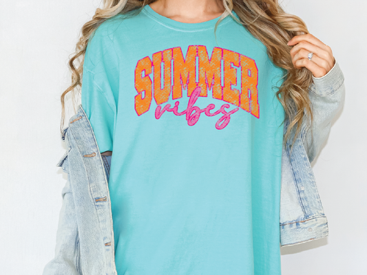 a woman wearing a blue shirt and jean jacket