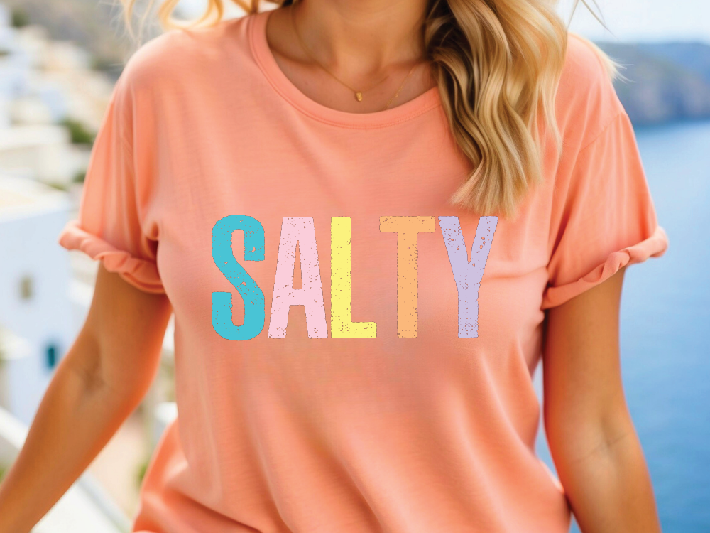 a woman wearing a t - shirt that says salty
