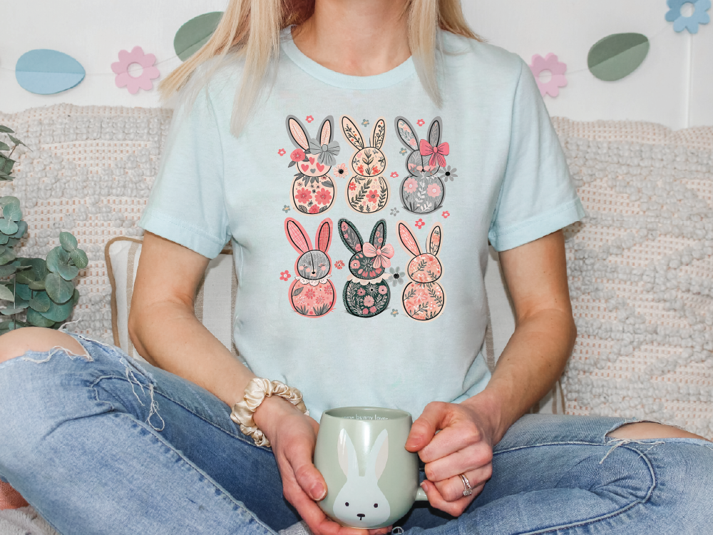 a woman sitting on a couch holding a cup