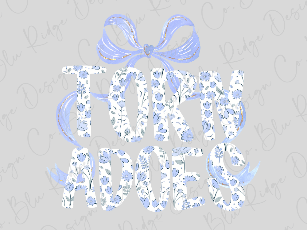 the text "TORN ADMIS" in a stylized font, with floral patterns and a bow-like design element.