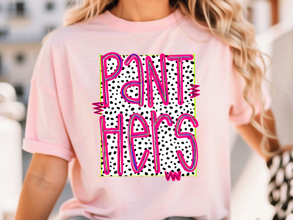 A woman wearing a pink t-shirt with the text "PANT HERS" printed on it.