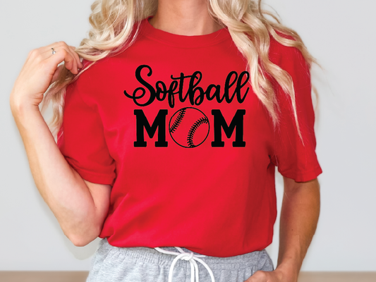 a woman wearing a red softball mom shirt