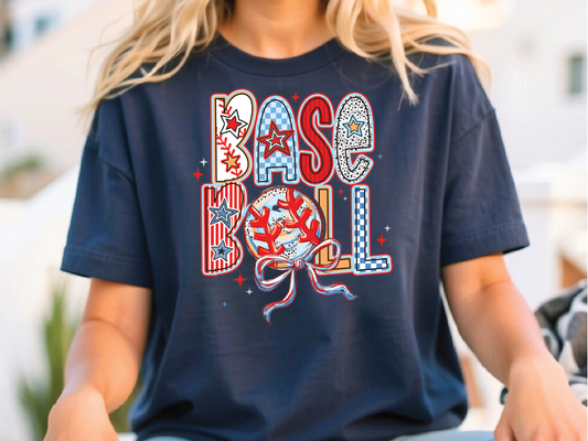 a woman sitting on a bench wearing a baseball t - shirt