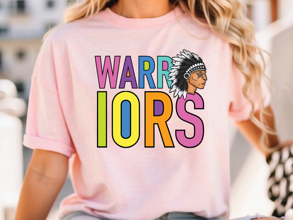 A woman wearing a pink t-shirt with the text "WARRIORS" printed on it.