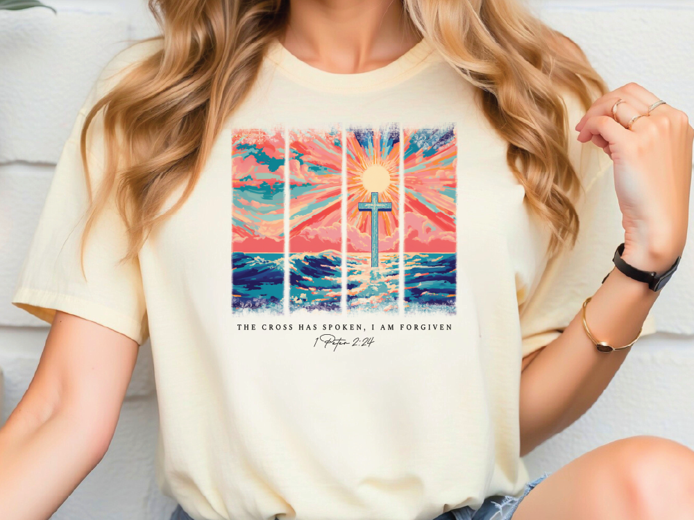 a woman wearing a t - shirt with a picture of a cross on it